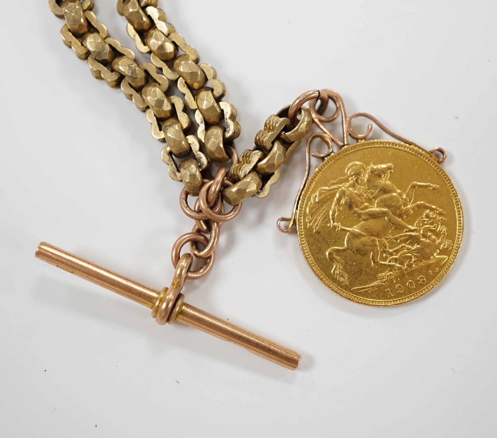 An Edwardian 9ct albertina, 34cm, hung with a Edward VII 1908 gold sovereign, gross weight 34.4 grams.
